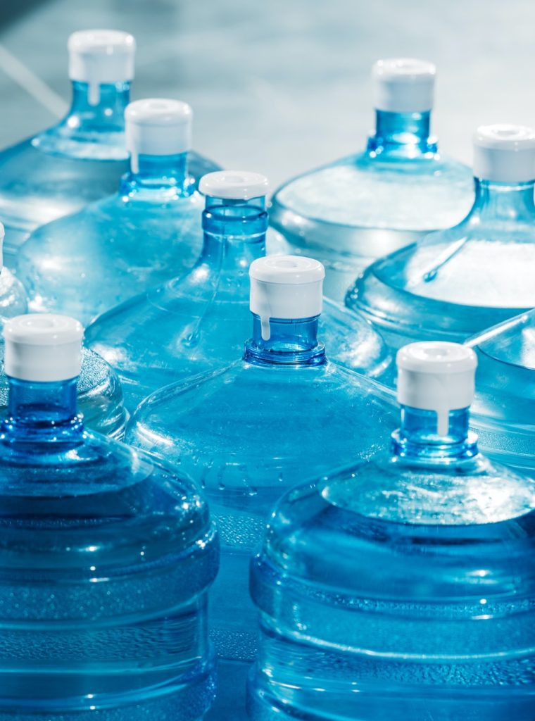 plastic-large-blue-water-bottles-on-floor.jpg